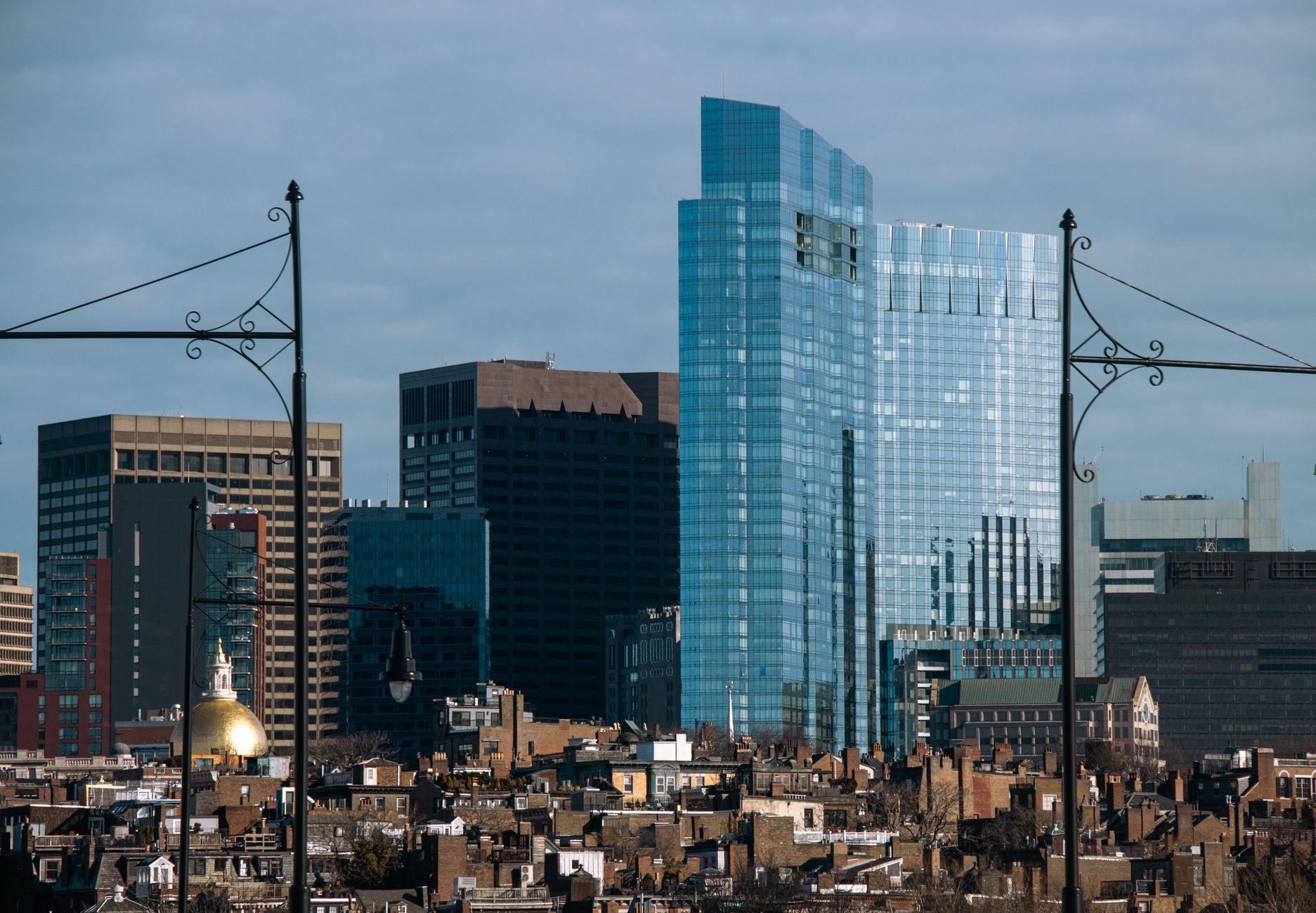 hard incentives for investors: A dynamic view of Boston's skyline showcasing modern skyscrapers and historic buildings under